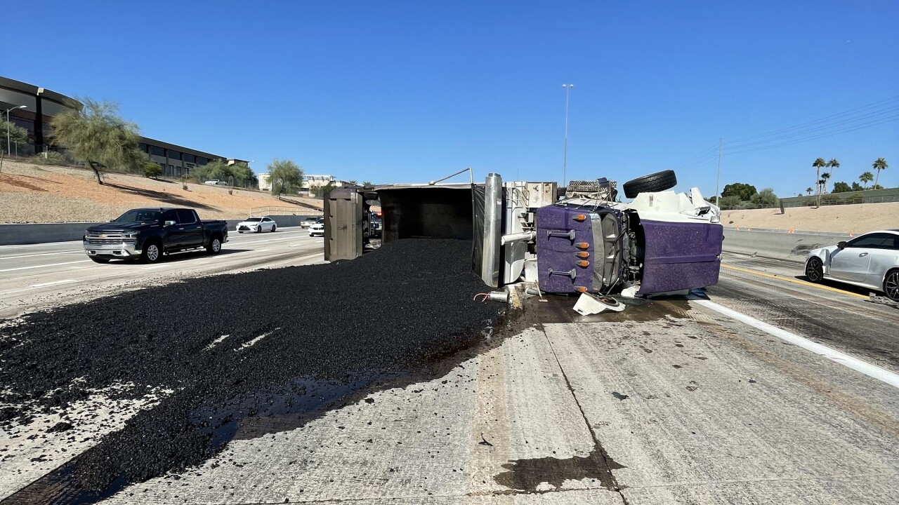 Truck carrying hot asphalt overturns on Loop 101 near Raintree Drive